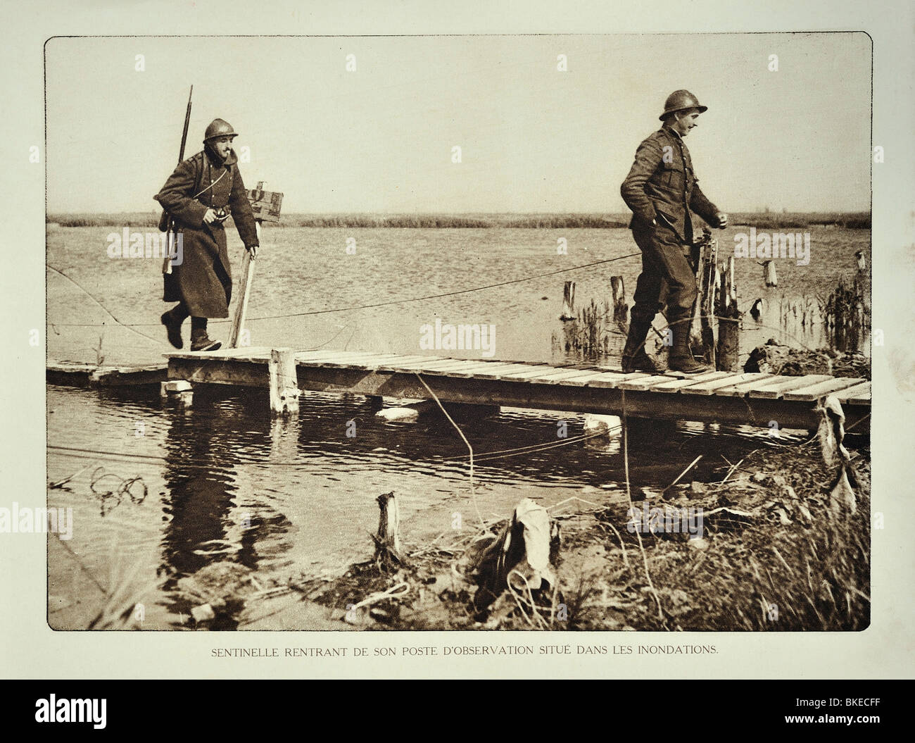 Belgian WWI soldier returning from observation post in flooded terrain in West Flanders during the First World War One, Belgium Stock Photo