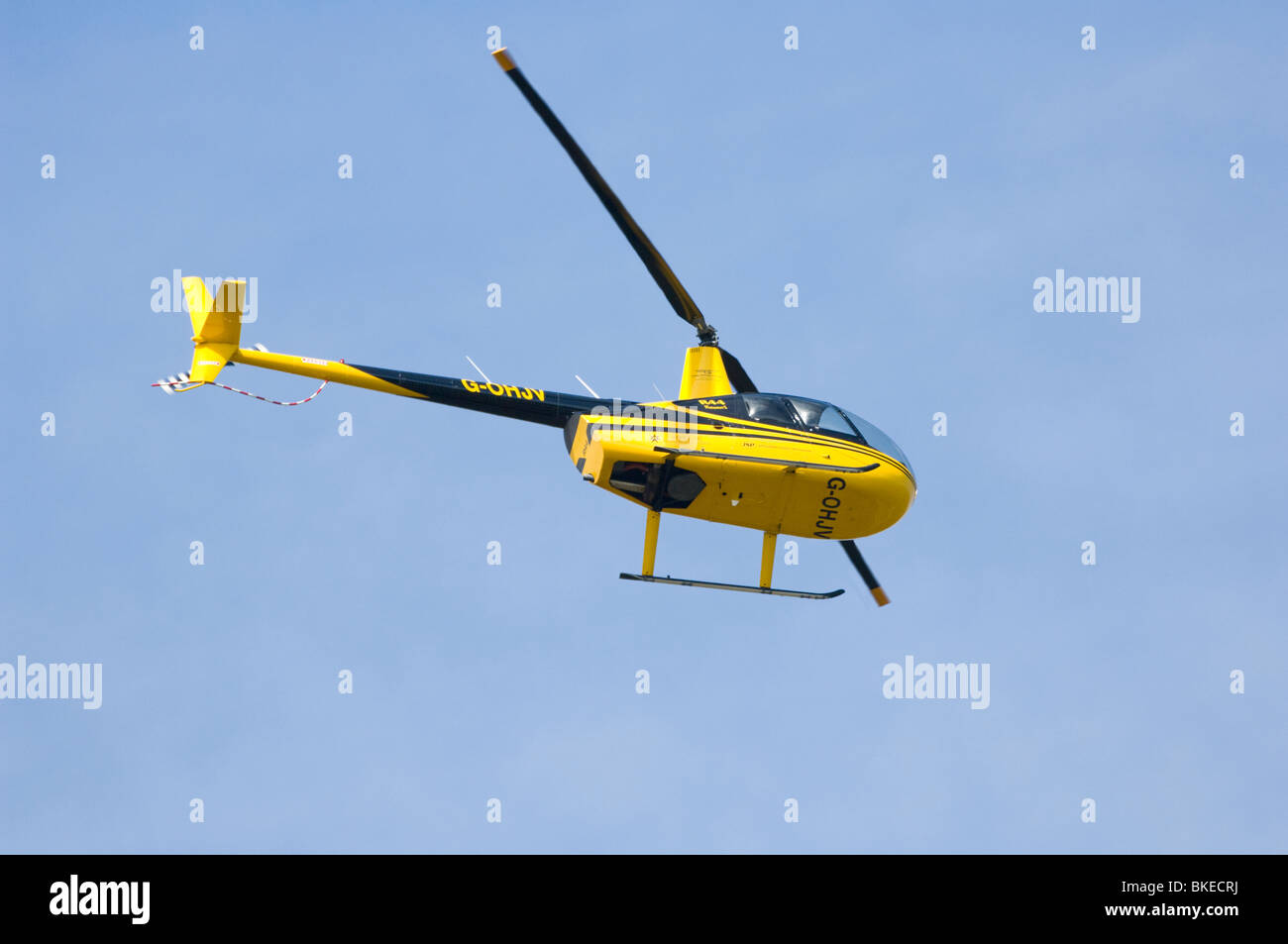 Yellow Robinson Helicopter Model R44 UK Stock Photo