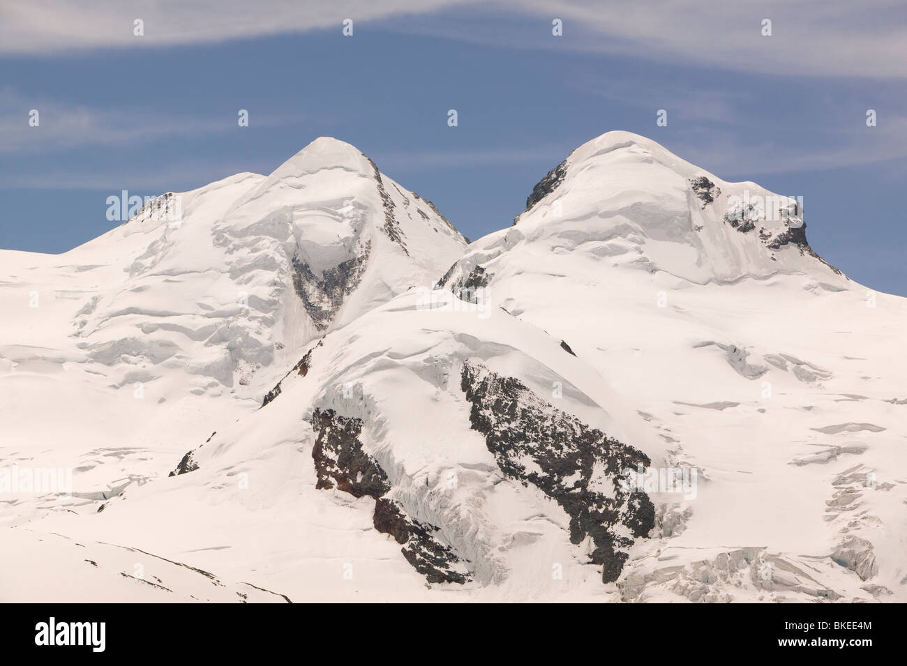 The twin peaks on Castor and Pollux above Zermatt Switzerland Stock