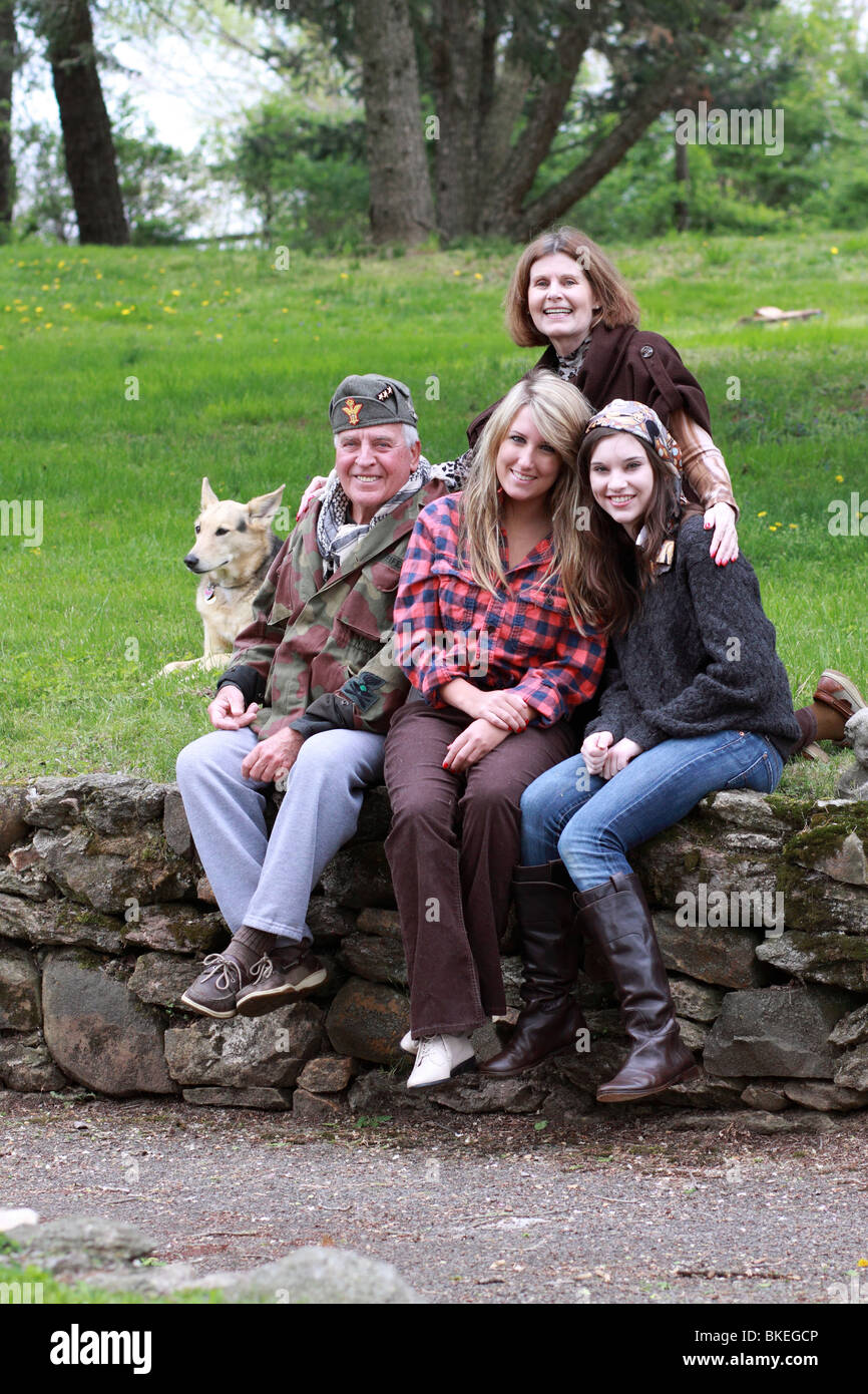 Family posing for portrait with dog Stock Photo