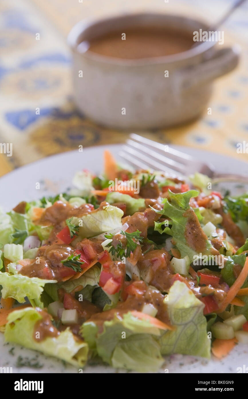 Green Leaf Salad With Dressing Stock Photo Alamy
