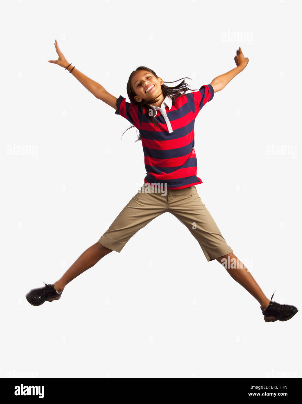 Girl Jumping With Arms And Legs Outstretched Stock Photo Alamy