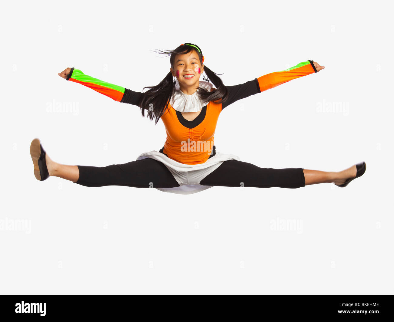 Girl Jumping With Legs And Arms Outstretched Stock Photo Alamy