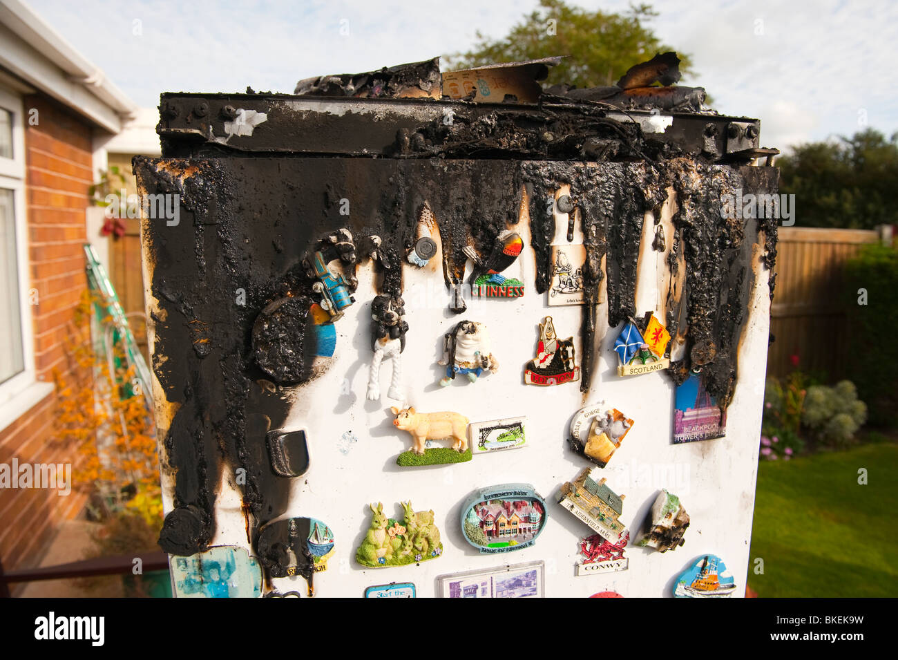 Domestic fridge freezer melted and burnt following fire caused by electrical control panel fault Stock Photo