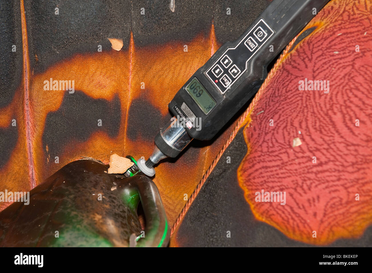 Accelerant detector measuring Volatile Organic Compunds at scene of arson fire Stock Photo