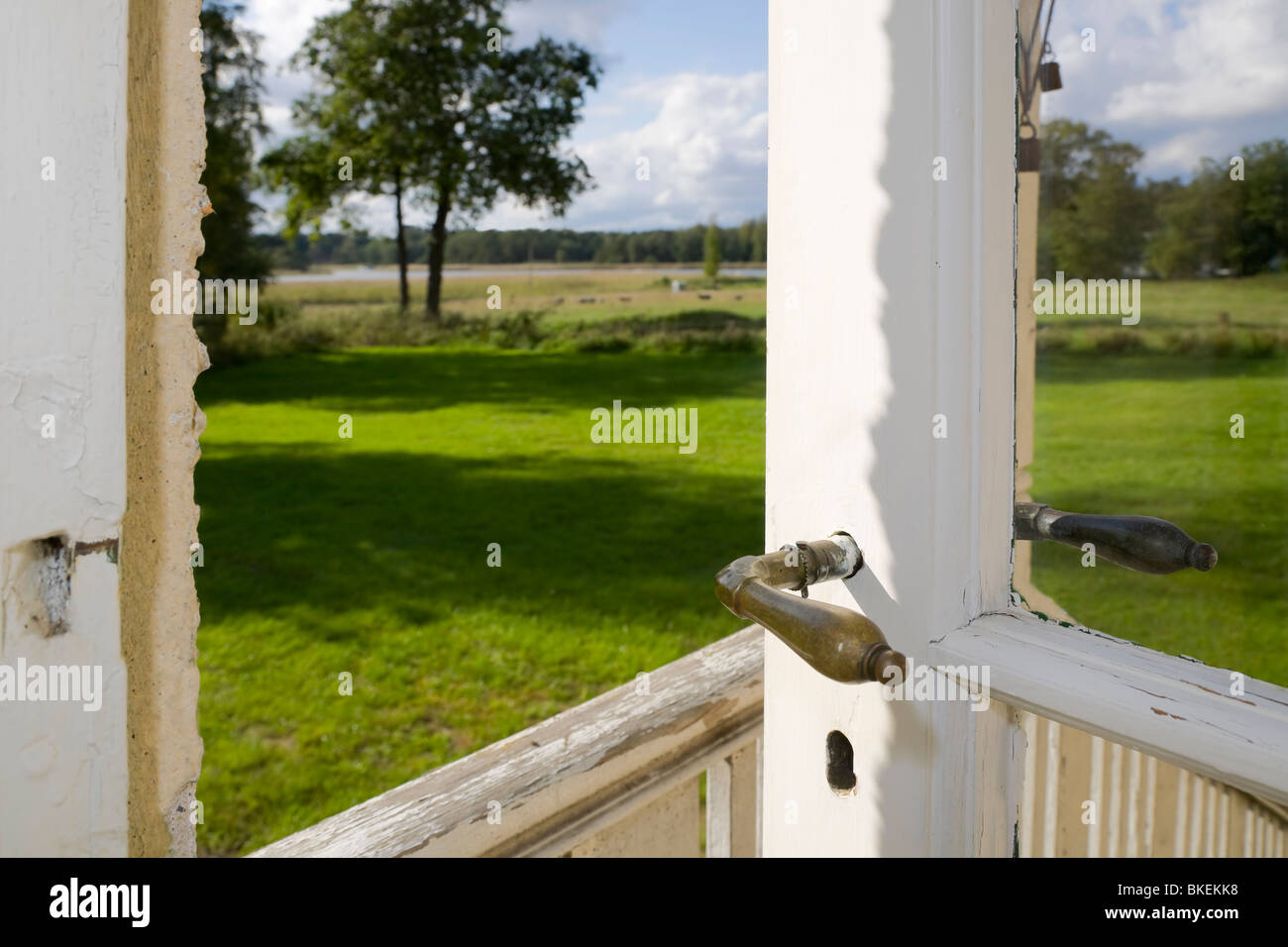 Oldfashioned glass door standing ajar Stock Photo Alamy
