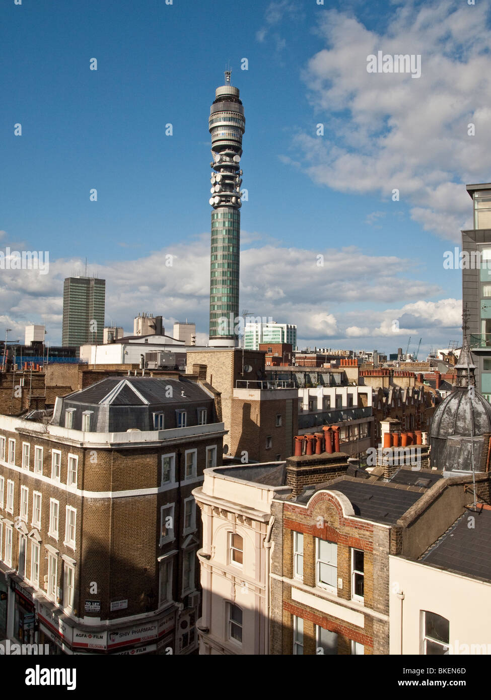 View of BT Tower over rooftops of central London UK Stock Photo