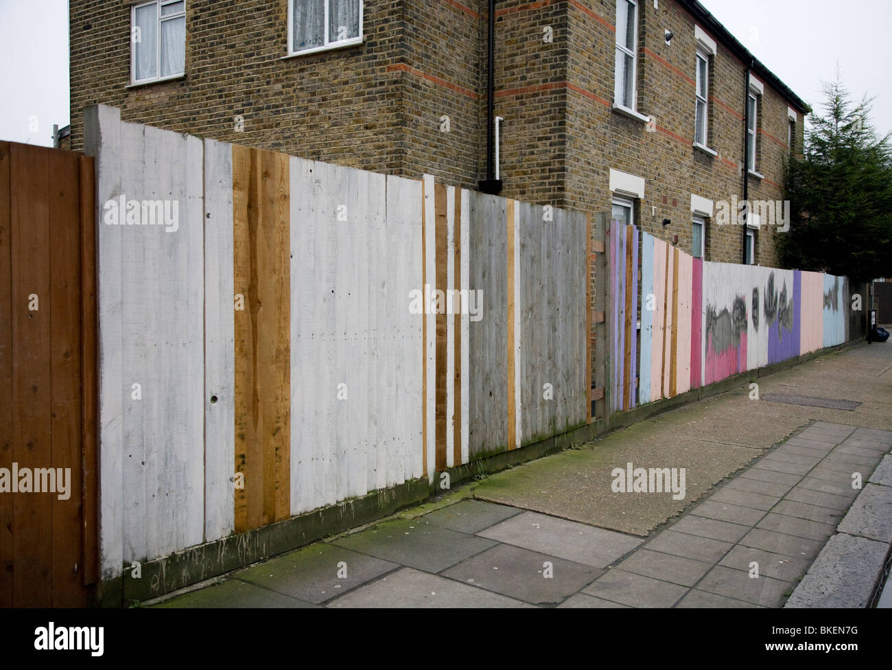 Multi-coloured painted fence Stock Photo