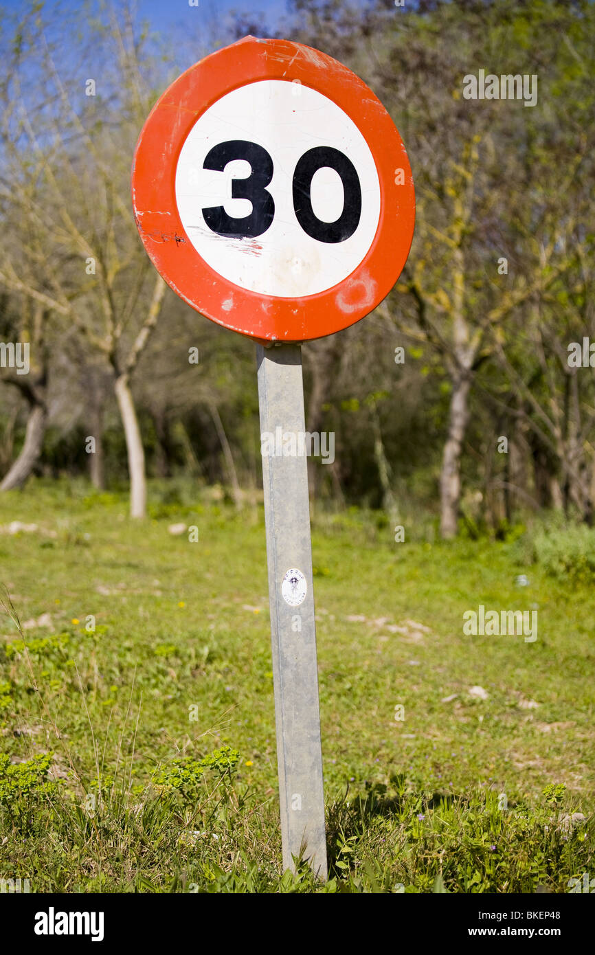 Speed limit signal in the countryside Stock Photo