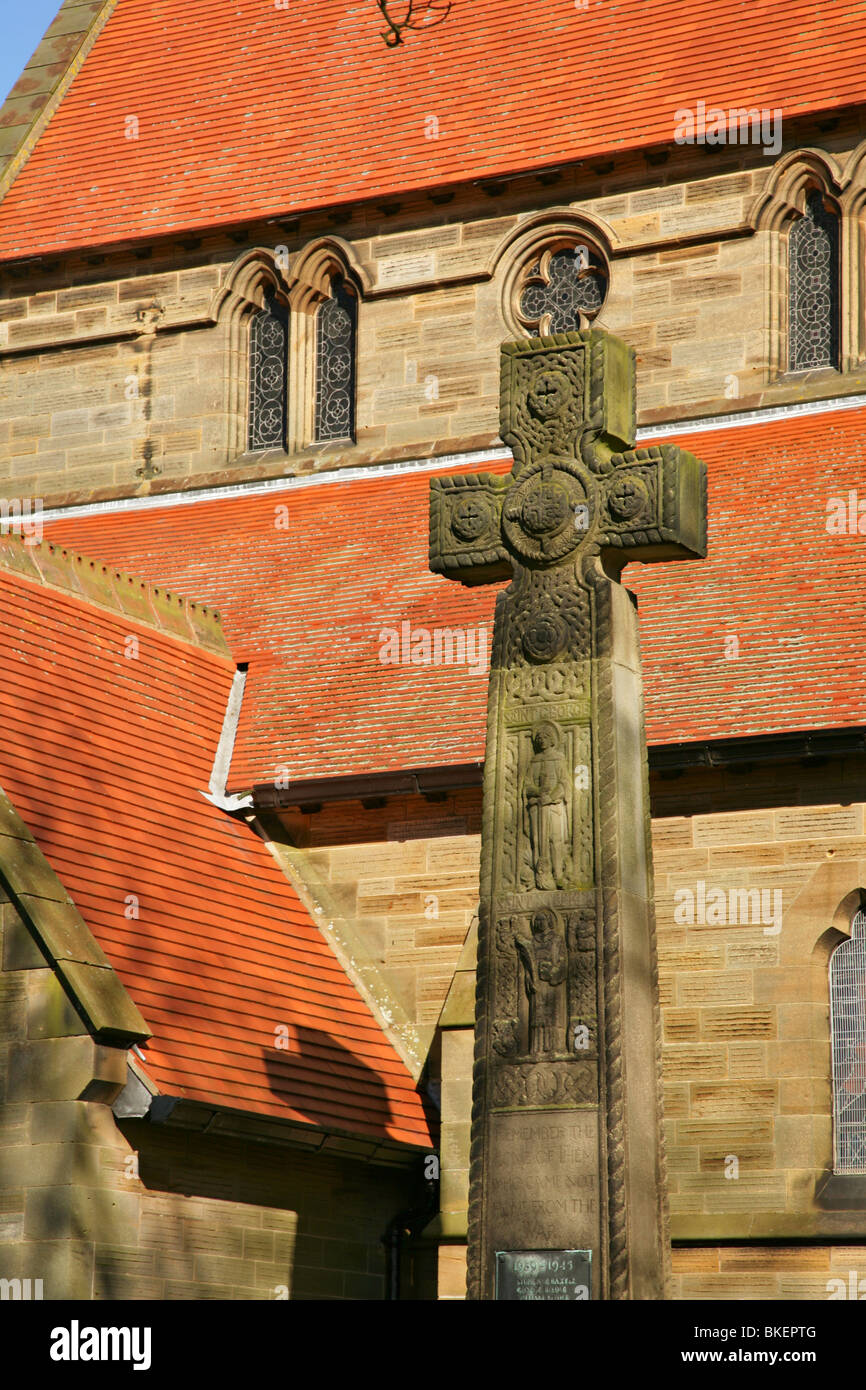 Ornate stone cross in Fylingthorpe churchyard near Robin Hood's Bay