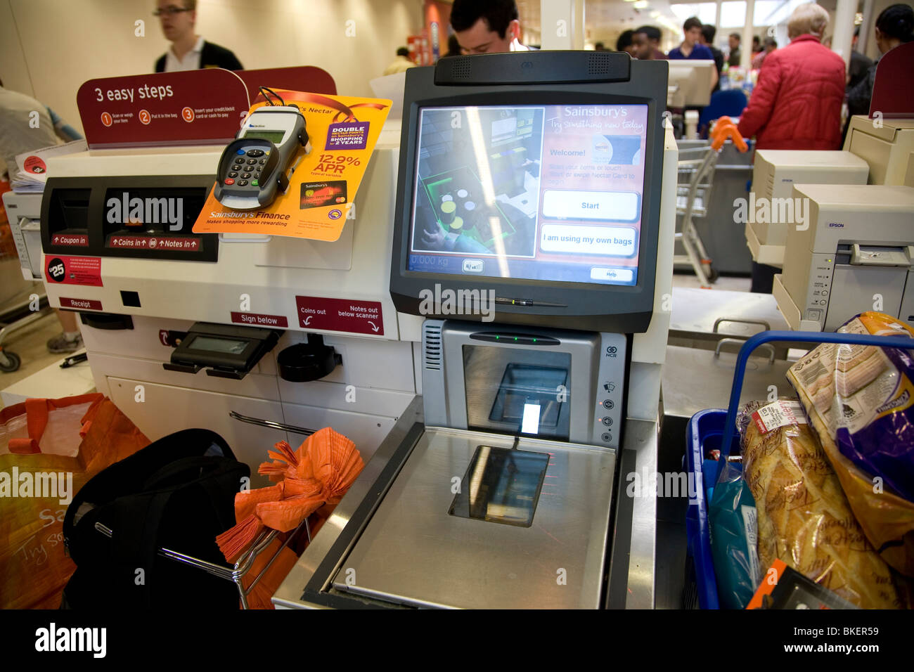 Sainsbury's check out terminal Stock Photo Alamy