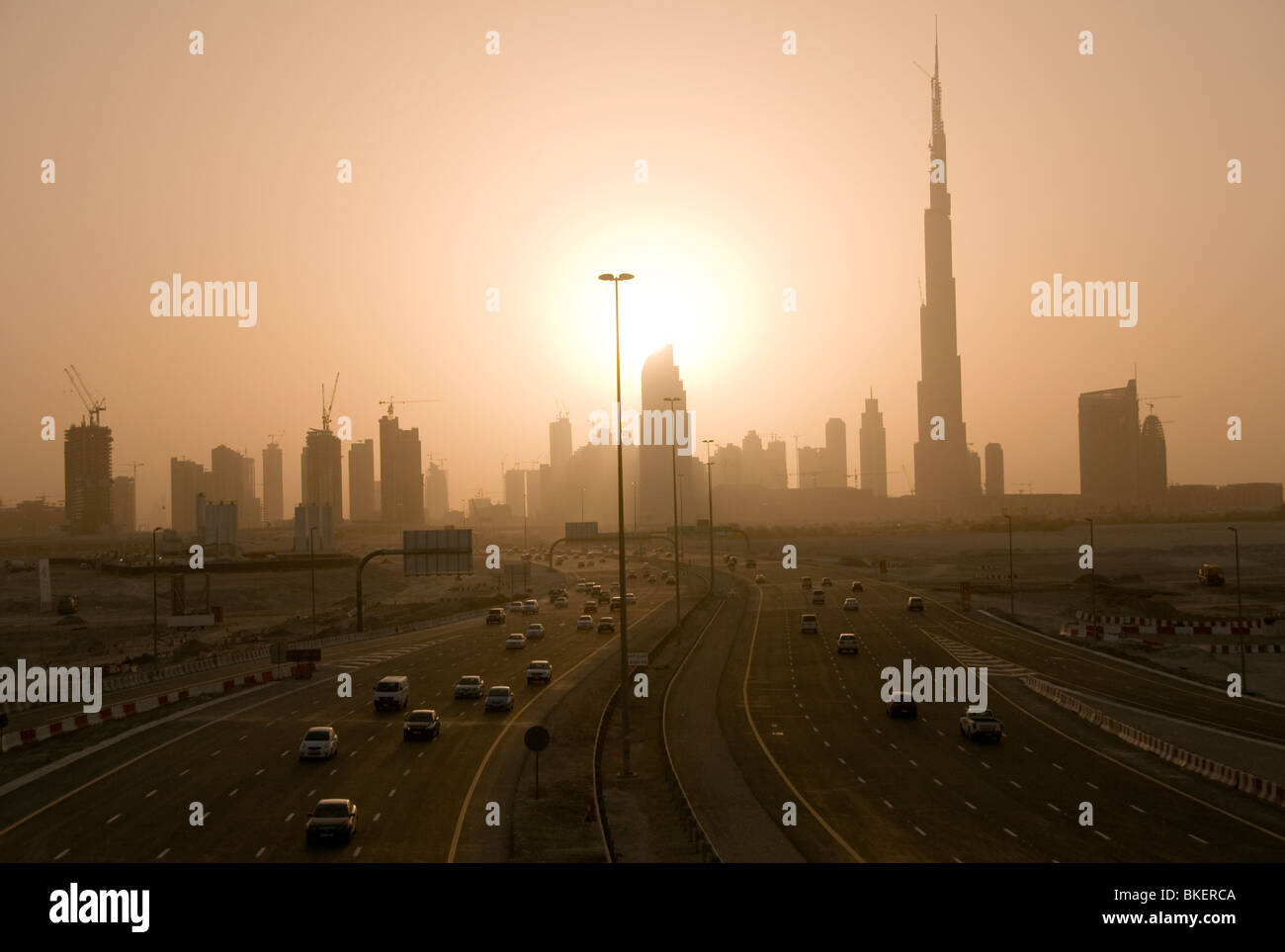 Road leading to Dubai skyline including the worlds tallest building on the right Burj Khalifa Stock Photo