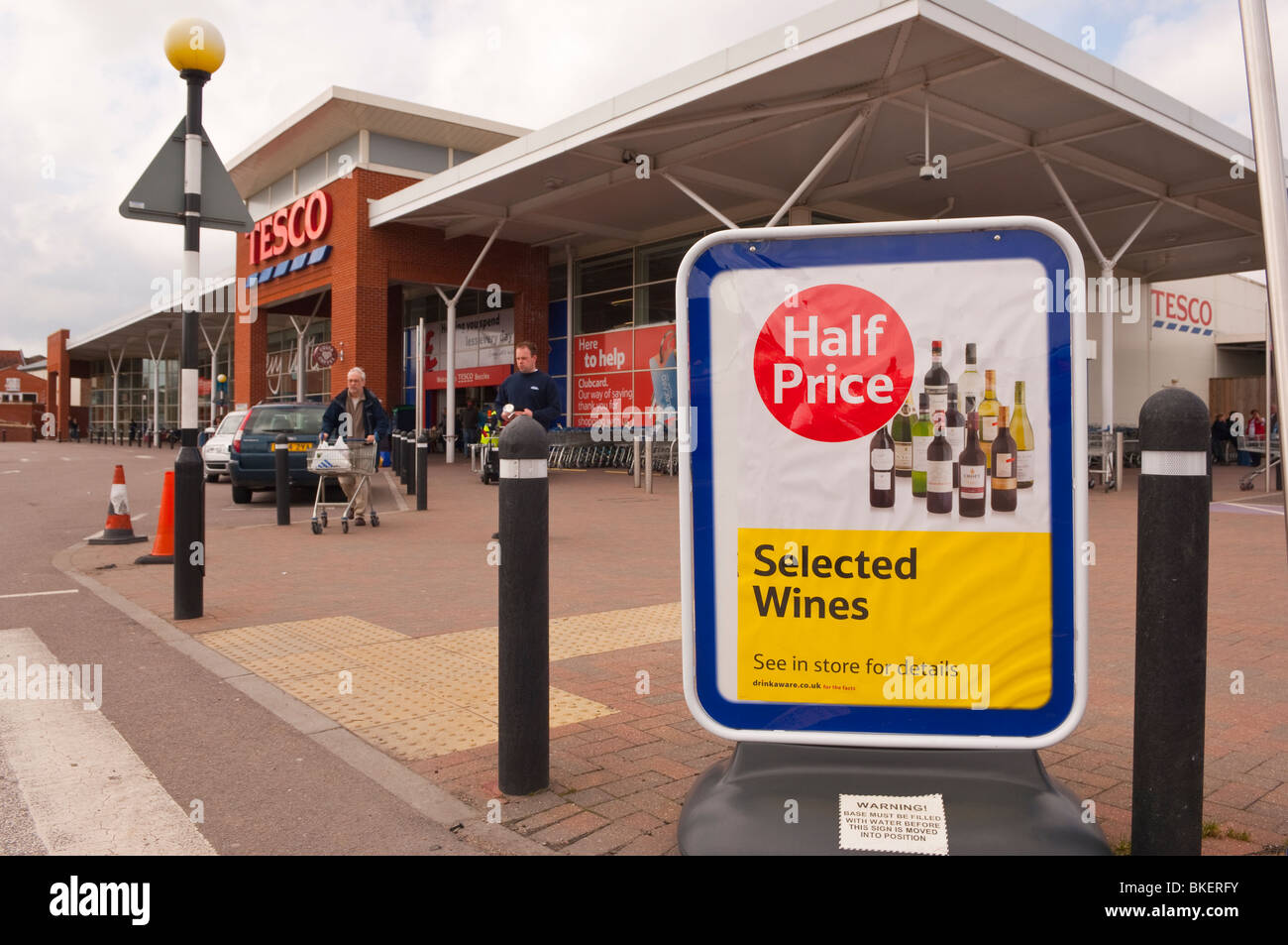 A sign advertising half price wines at the Tesco Superstore in Beccles , Suffolk , England , Great Britain , UK Stock Photo