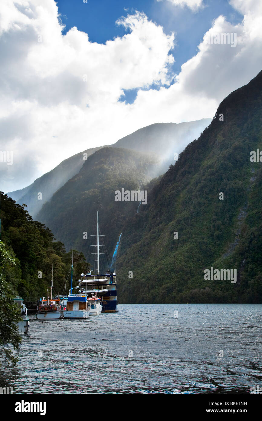 Boats on Doubtful Sound, Fiordland, South Island, New Zealand Stock Photo