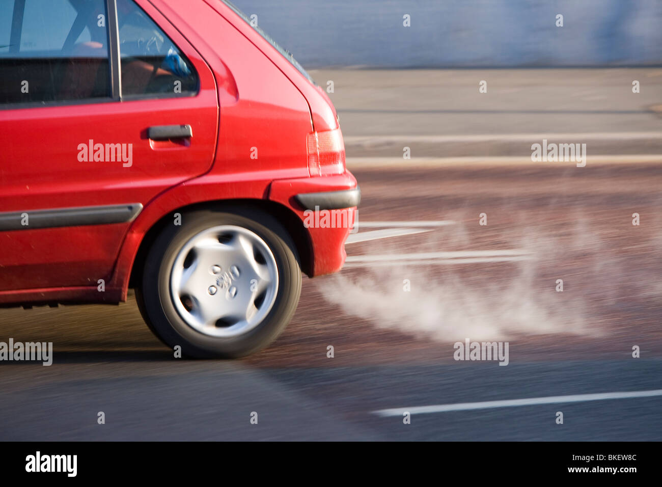 Exhaust fumes from a car exhaust pipe in freezing weather UK Stock