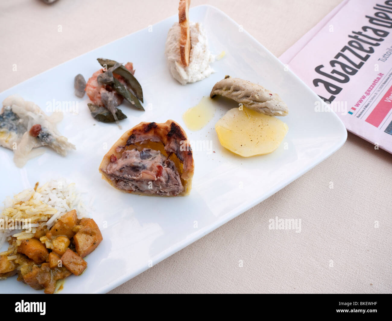 Detail of plate of traditional seafood Cicheti tapas  snacks at Osterie in Venice Italy Stock Photo
