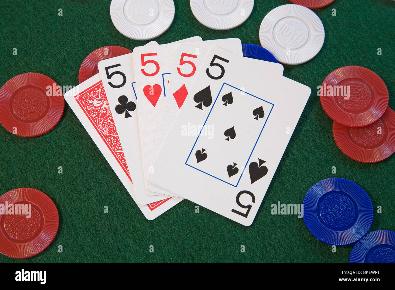 Four of a kind, on poker chips, a poker hand in five card draw or stud poker Stock Photo