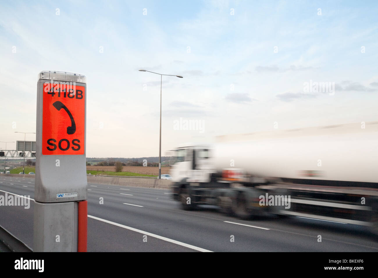 SOS telephone phone box by the side of the M25 motorway , Kent, UK
