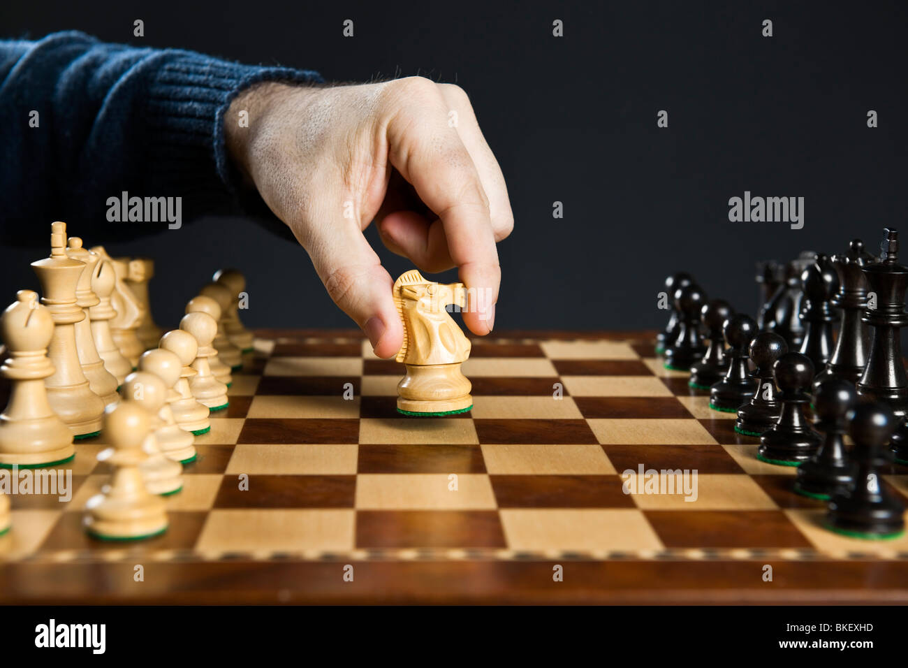 Hand Of A Man Taking A Chess Piece To Make The Next Move In A Chess Game.  Close Up. Spring Day Outside. Stock Photo, Picture and Royalty Free Image.  Image 198493516.