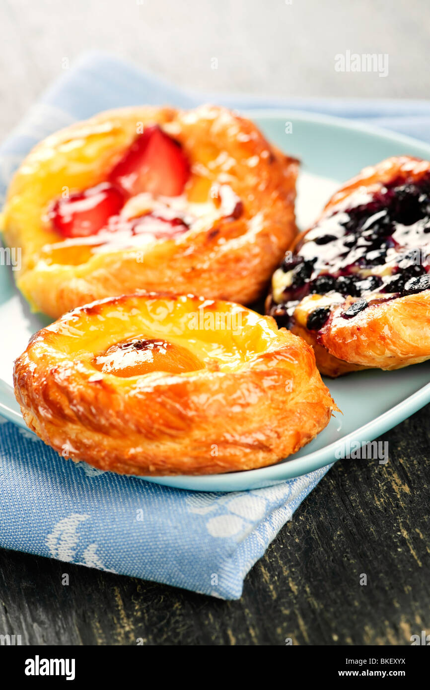 Closeup of three fruit danish desserts on a plate Stock Photo