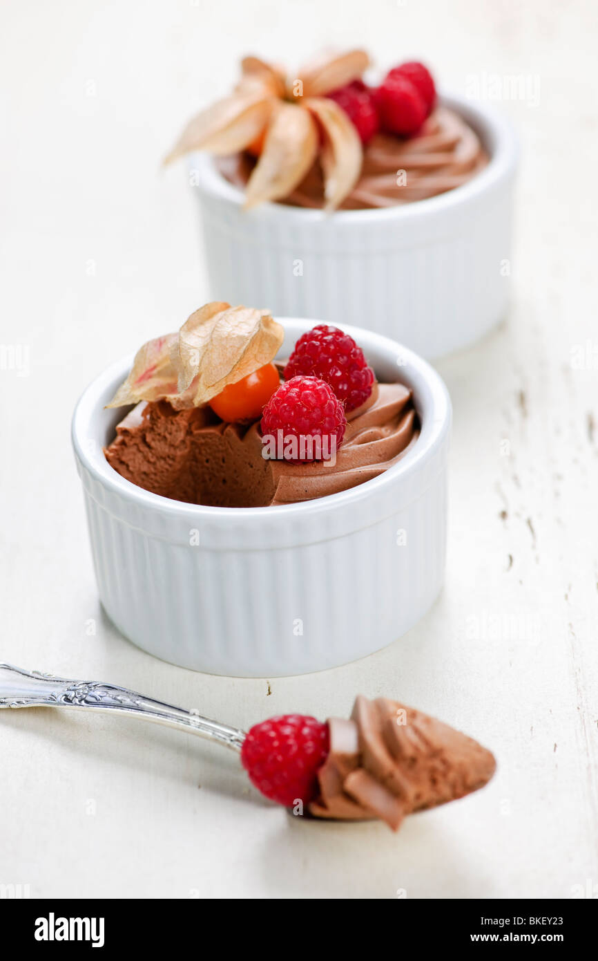 Two chocolate mousse desserts with a spoon Stock Photo