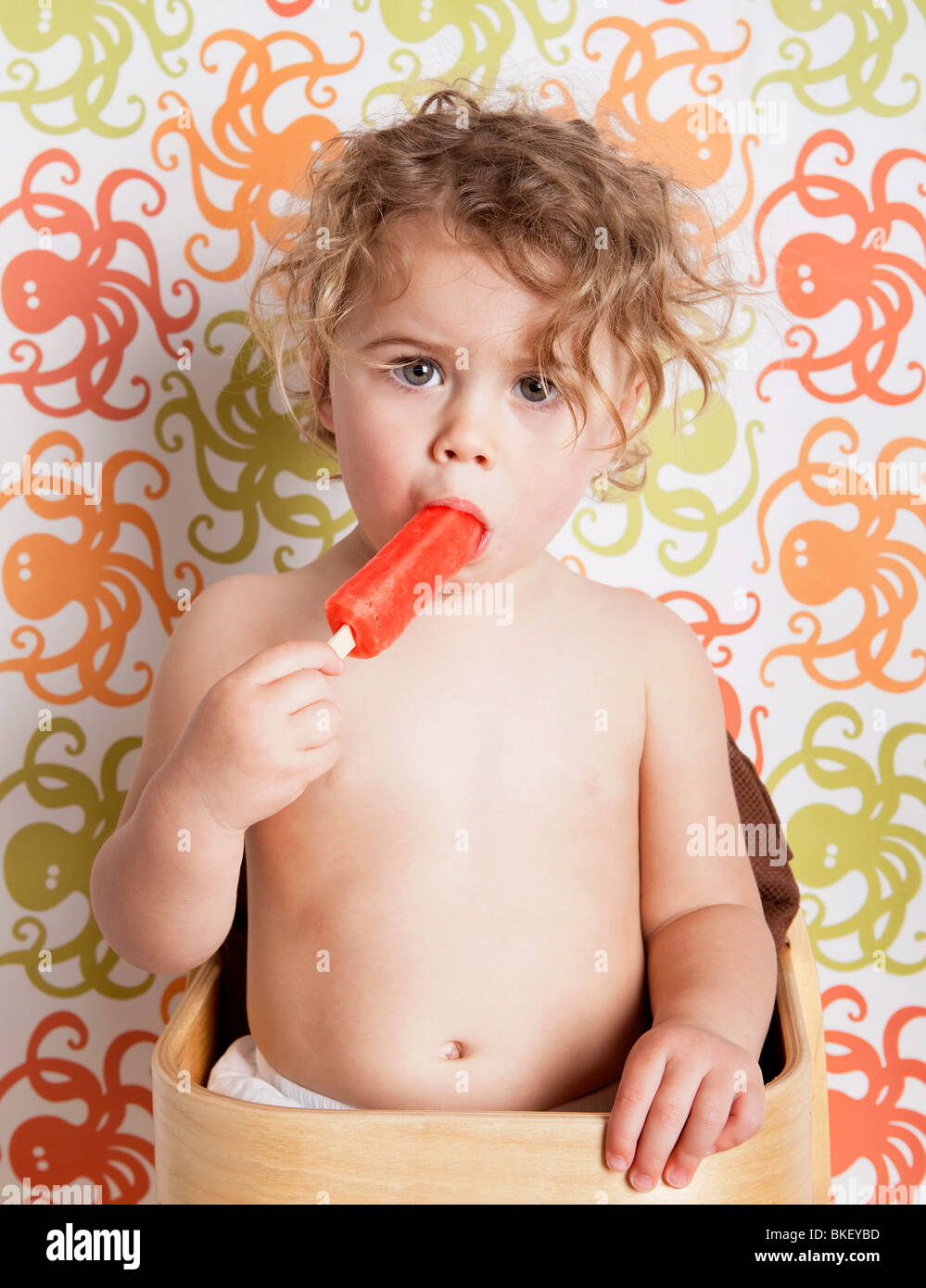 Young child eating a popsicle Stock Photo