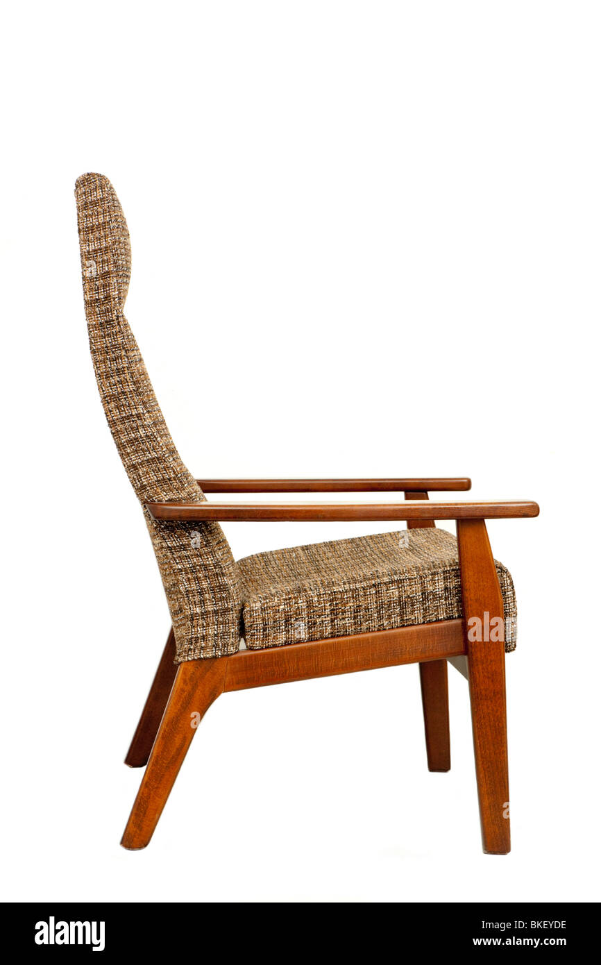 Side view of vintage classic Parker Knoll PK1067-70 high back easy chair with checkered upholstery, isolated on white background Stock Photo