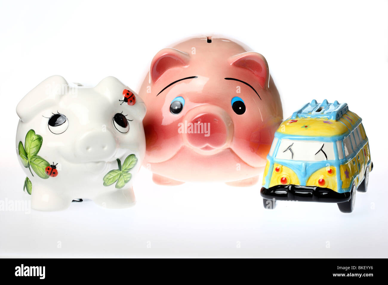 coin bank in form of a pig and a little bus, ceramic Stock Photo