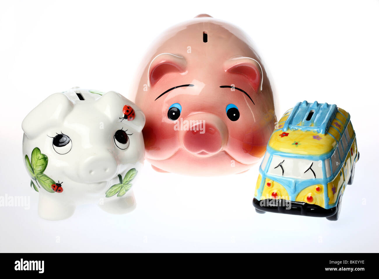 coin bank in form of a pig and a little bus, ceramic Stock Photo