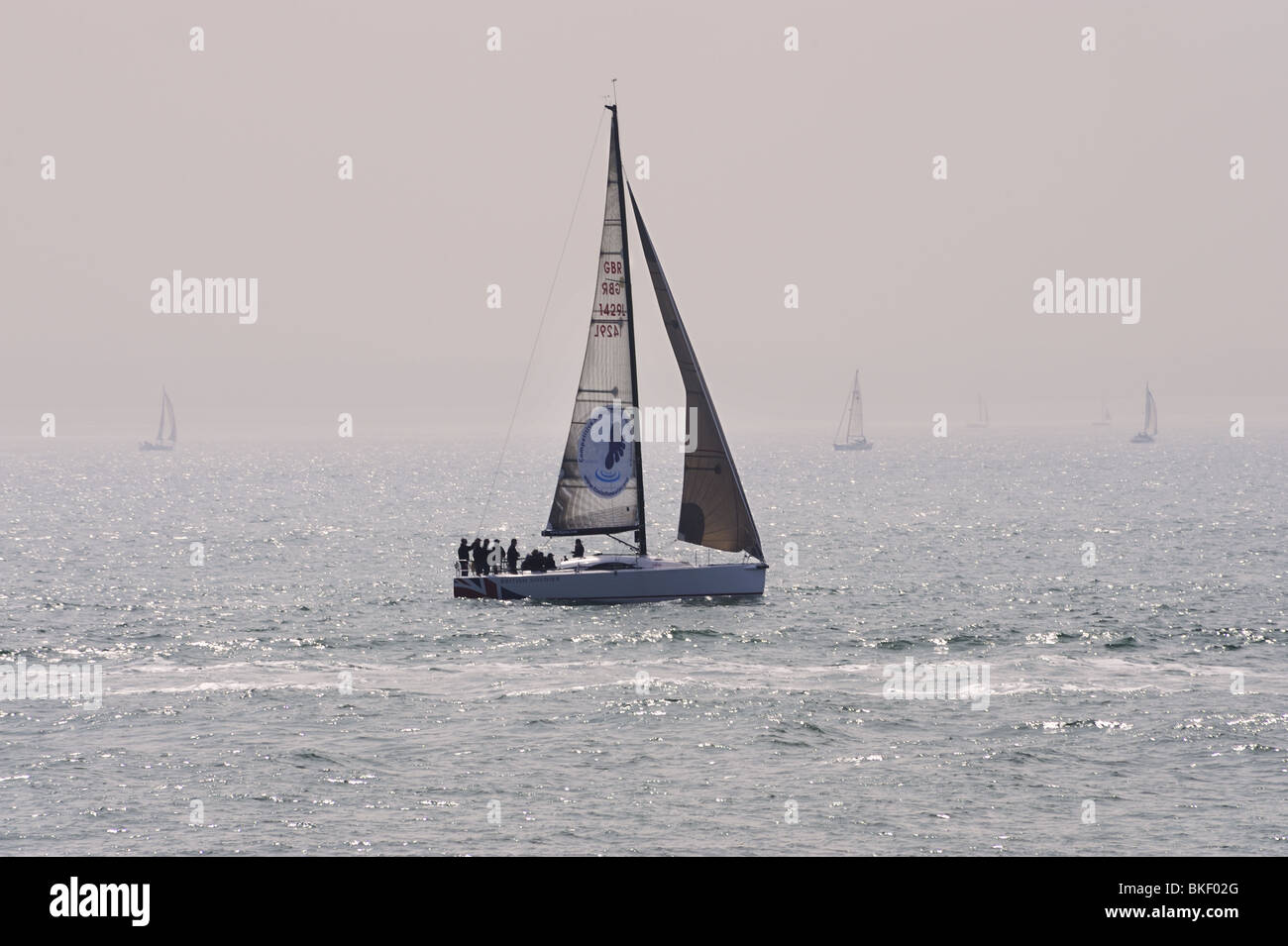 Yatch, 'British Soldier', sailing off Southsea, Hampshire, in misty sunlight Stock Photo