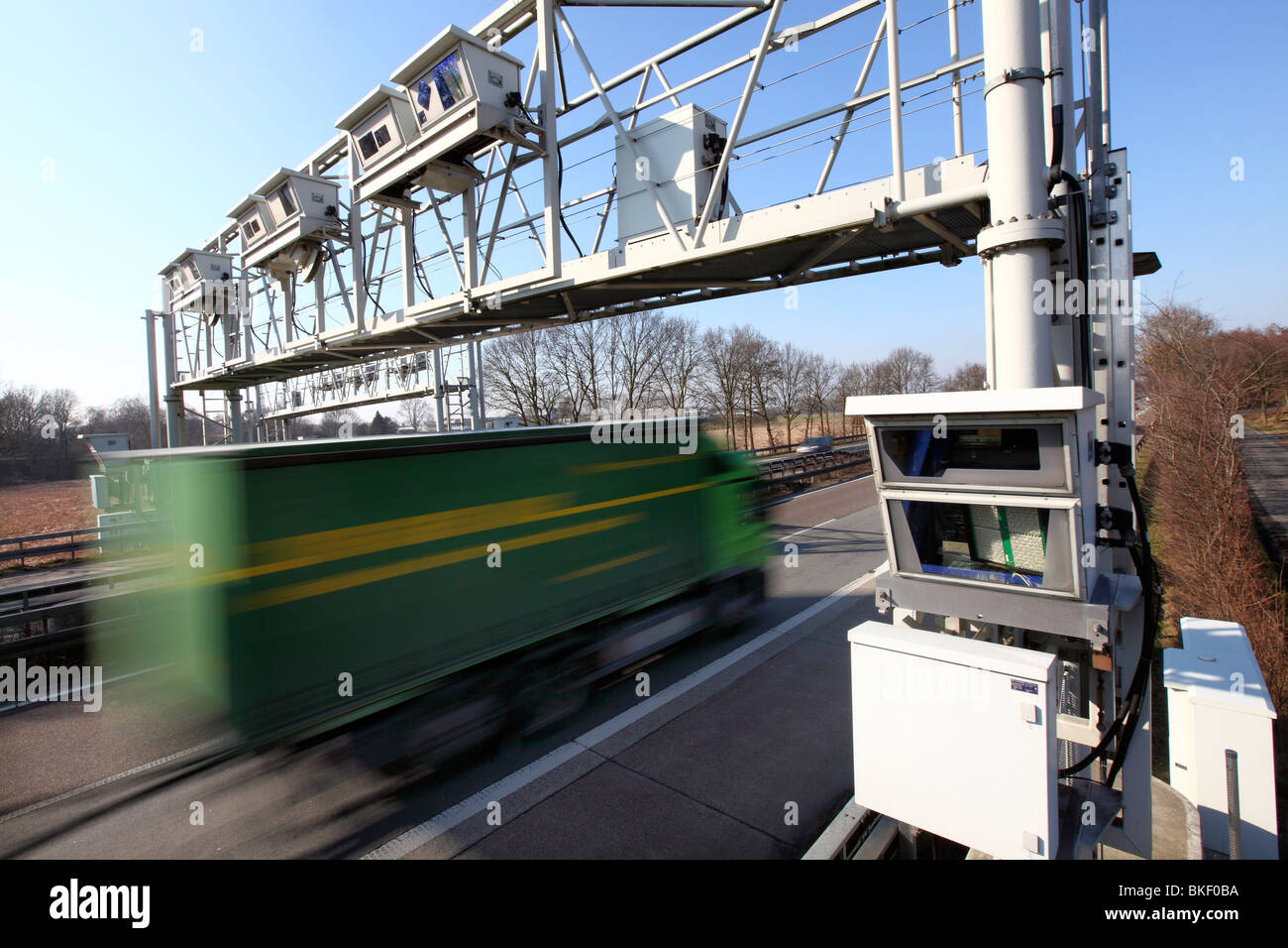 Toll bridge on a motorway in Germany. Detectors in the bridge register all trucks, which have to pay toll on German motorways. Stock Photo