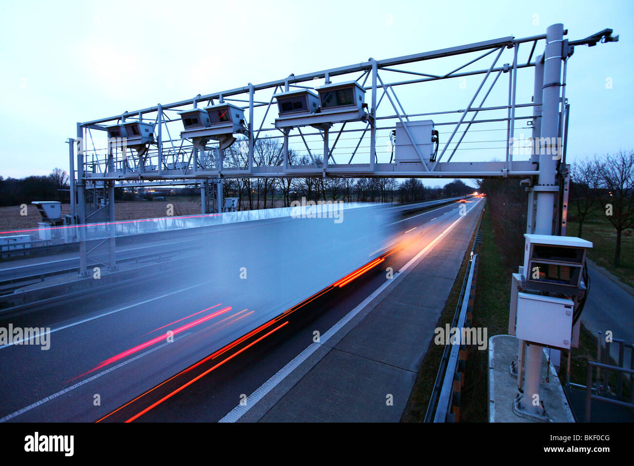 Toll bridge on a motorway in Germany. Detectors in the bridge register all trucks, which have to pay toll on German motorways. Stock Photo