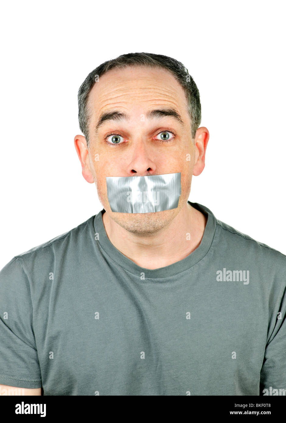 Portrait of man with duct tape over his mouth Stock Photo - Alamy