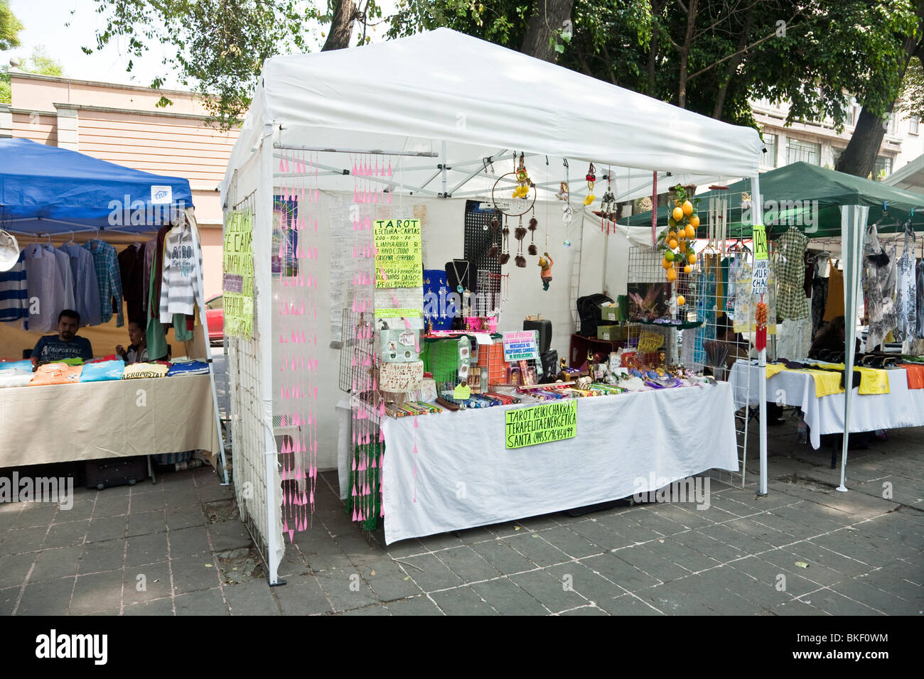 colorful booths at outdoor weekend craft market in Roma district of