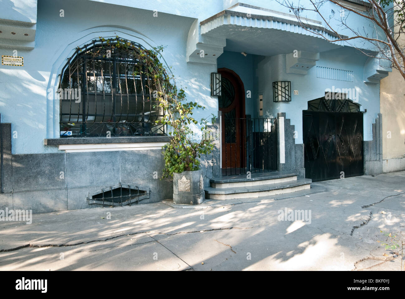 ground floor facade of beautifully detailed blue stucco Art Deco house in Condesa District Mexico City Stock Photo