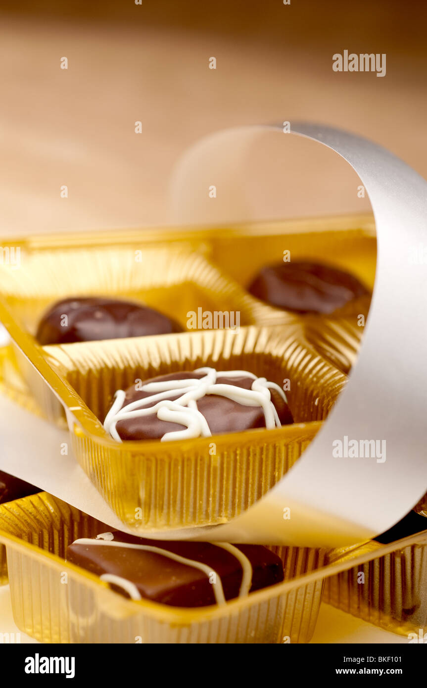 A vertical image of two trays of chocolates Stock Photo