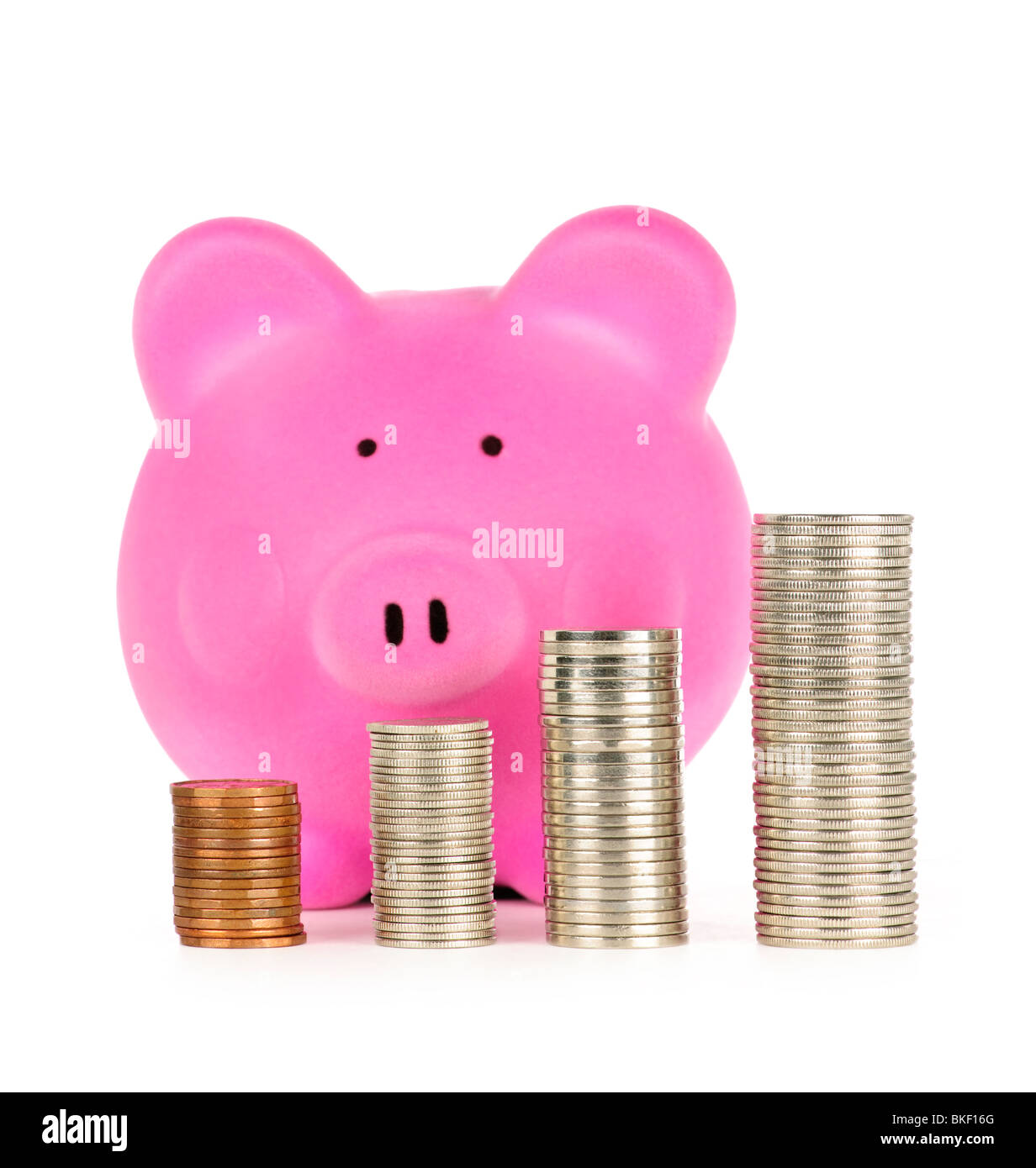 Stacks of coins in front of pink piggy bank showing growth Stock Photo ...