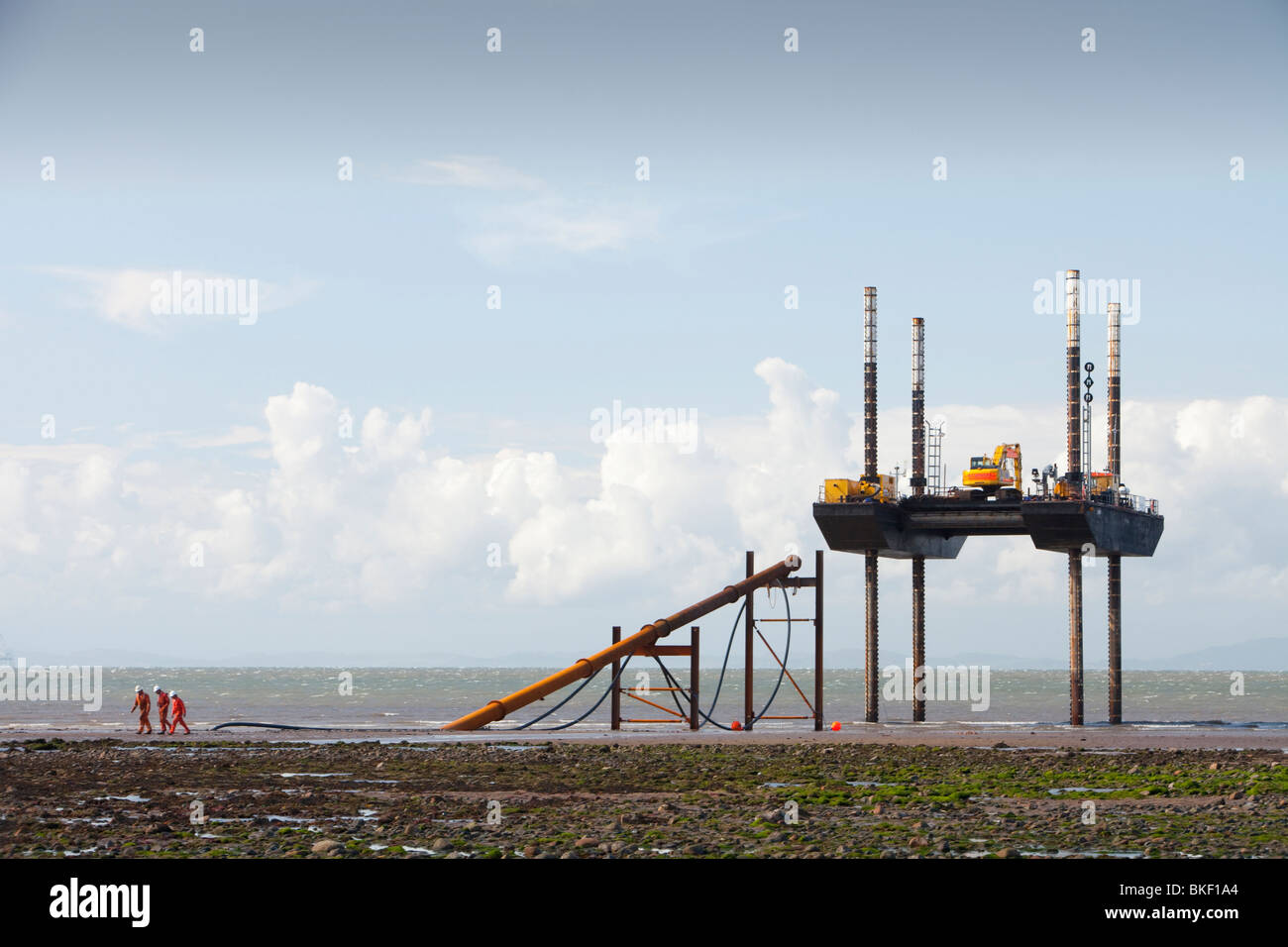 Installing the electric cable ashore from the Robin Rigg offshore windfarm in the Solway  Firth, UK Stock Photo