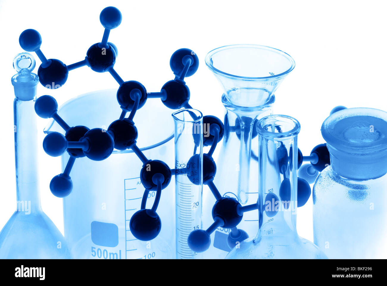 Laboratory glass with atom model on the white. Stock Photo