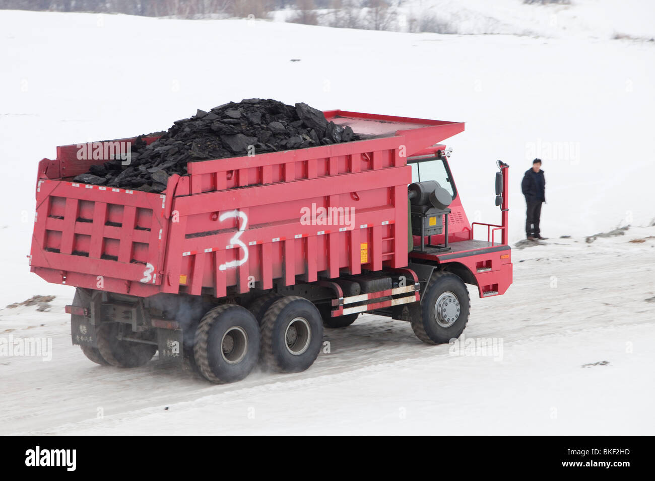 A lorry taking coal from an open cast coal mine on the Chinese Russian border near Heihe city. Stock Photo