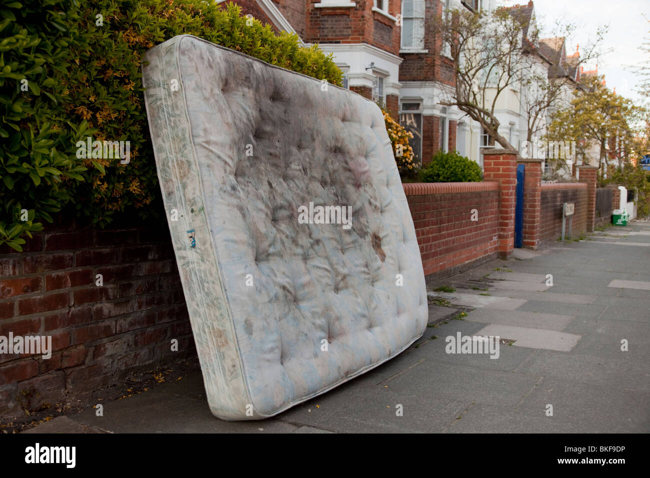 Dirty mattress left in a North London Street Stock Photo