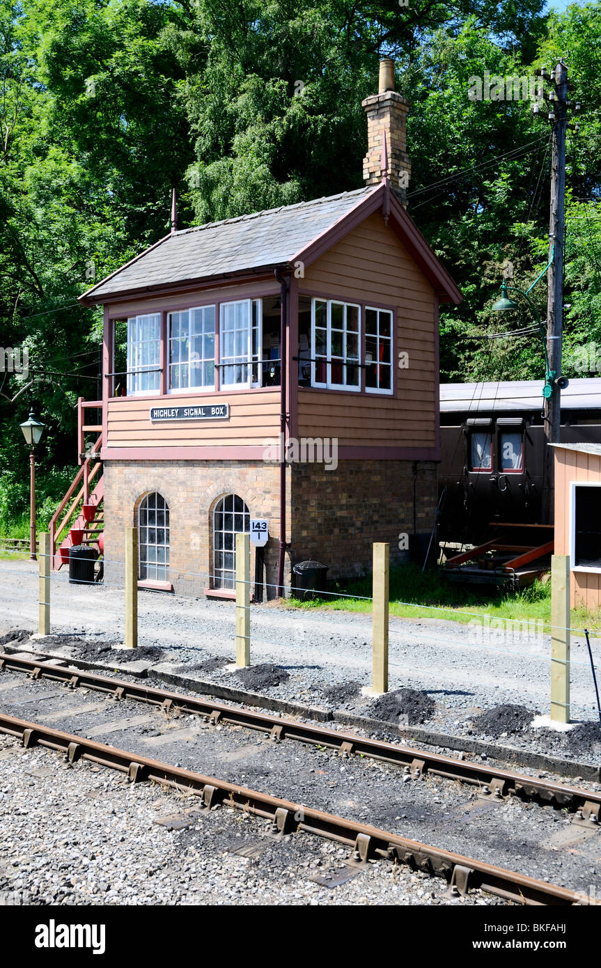 An old railway coach stands behind the signal box at Highley, Severn Valley Stock Photo