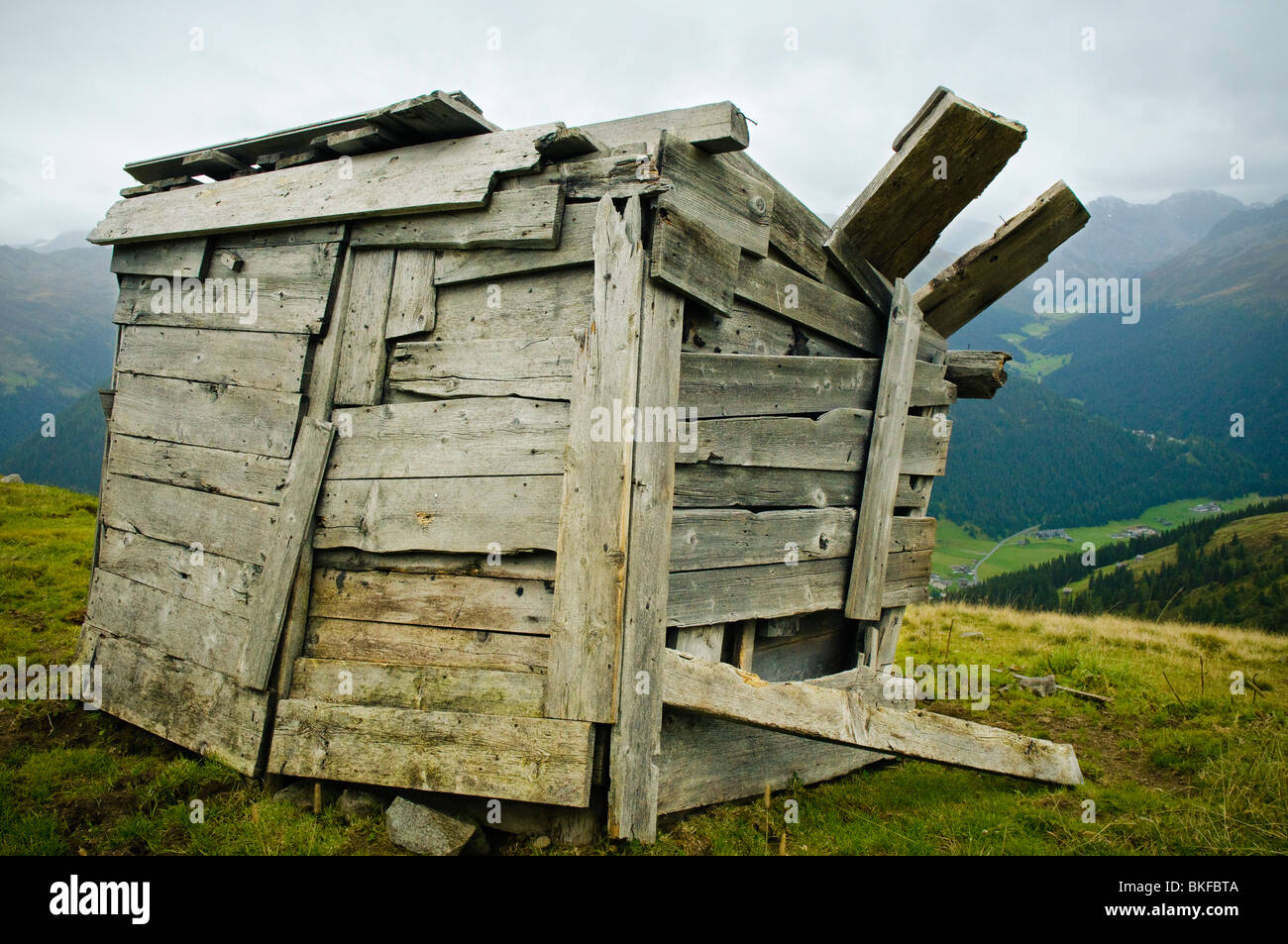 Dilapidated wooden hut on a high pasture above Davos, Graubünden, Switzerland Stock Photo