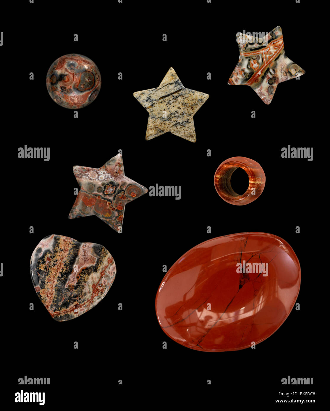 Various shapes of cut & polished Jasper on a black background Stock