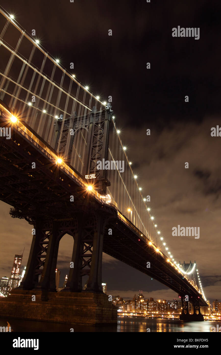 New York City Skyline and Manhattan Bridge At Night Stock Photo