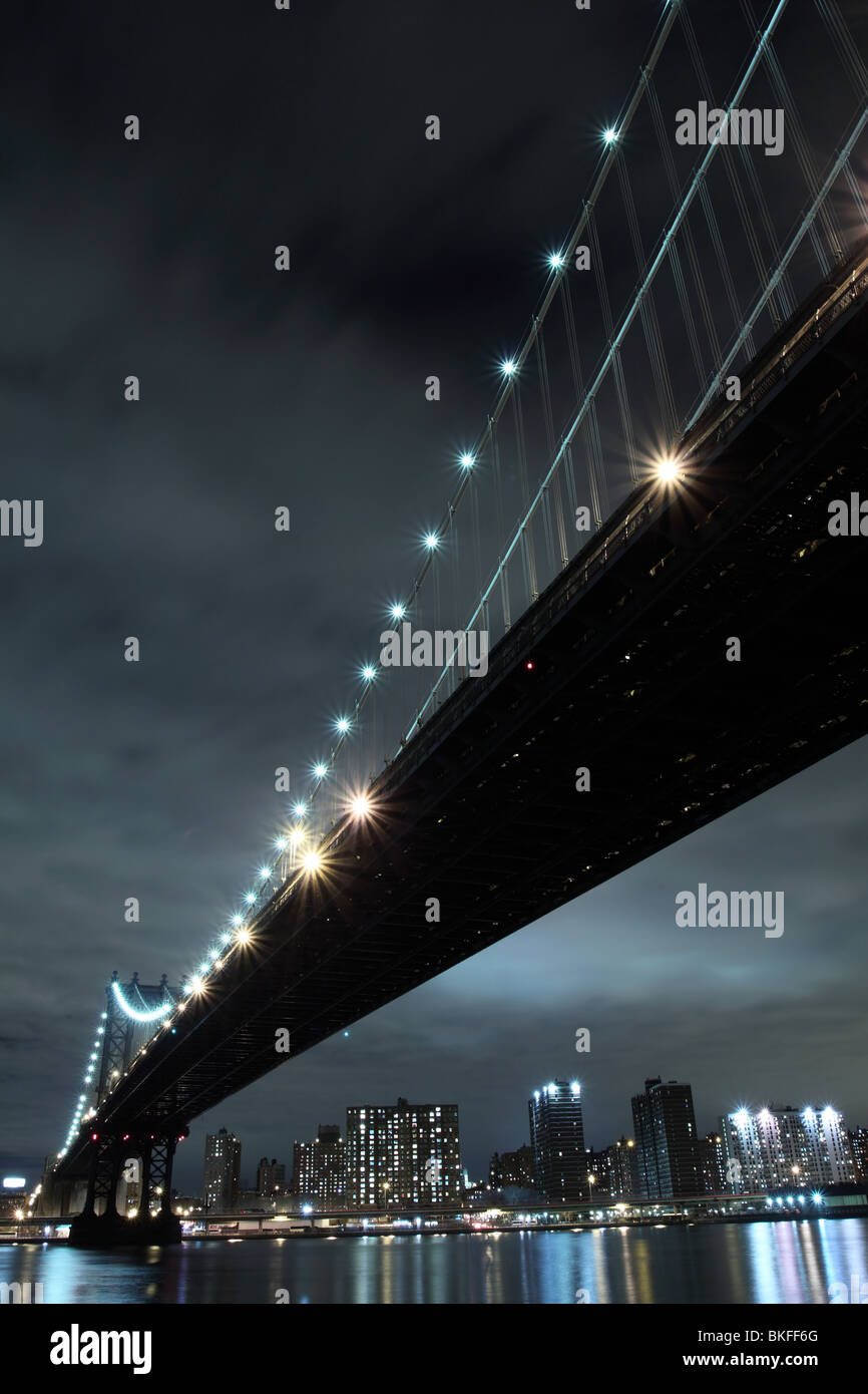 New York City Skyline and Manhattan Bridge At Night Stock Photo - Alamy