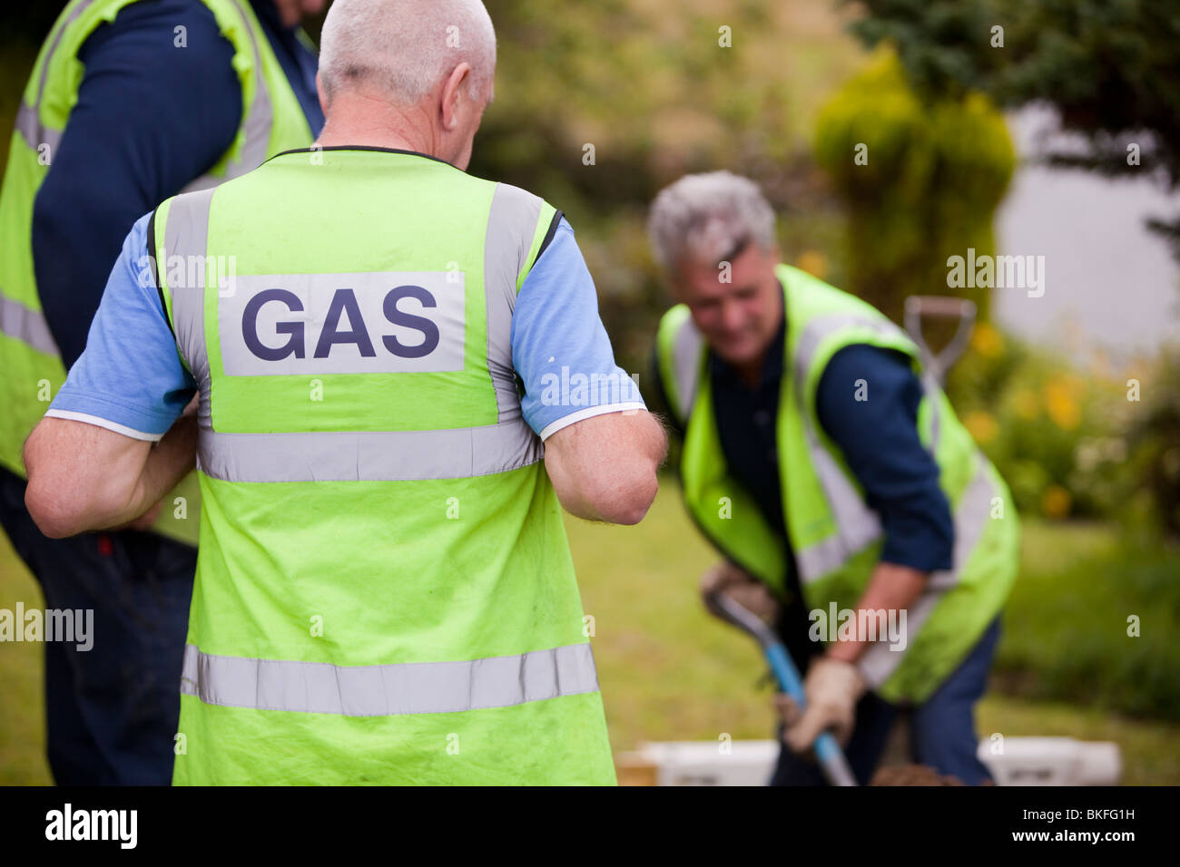 Workers from British Gas replacing old metal gas pipes with plastic piping in Ambleside, Cumbria, UK. Stock Photo