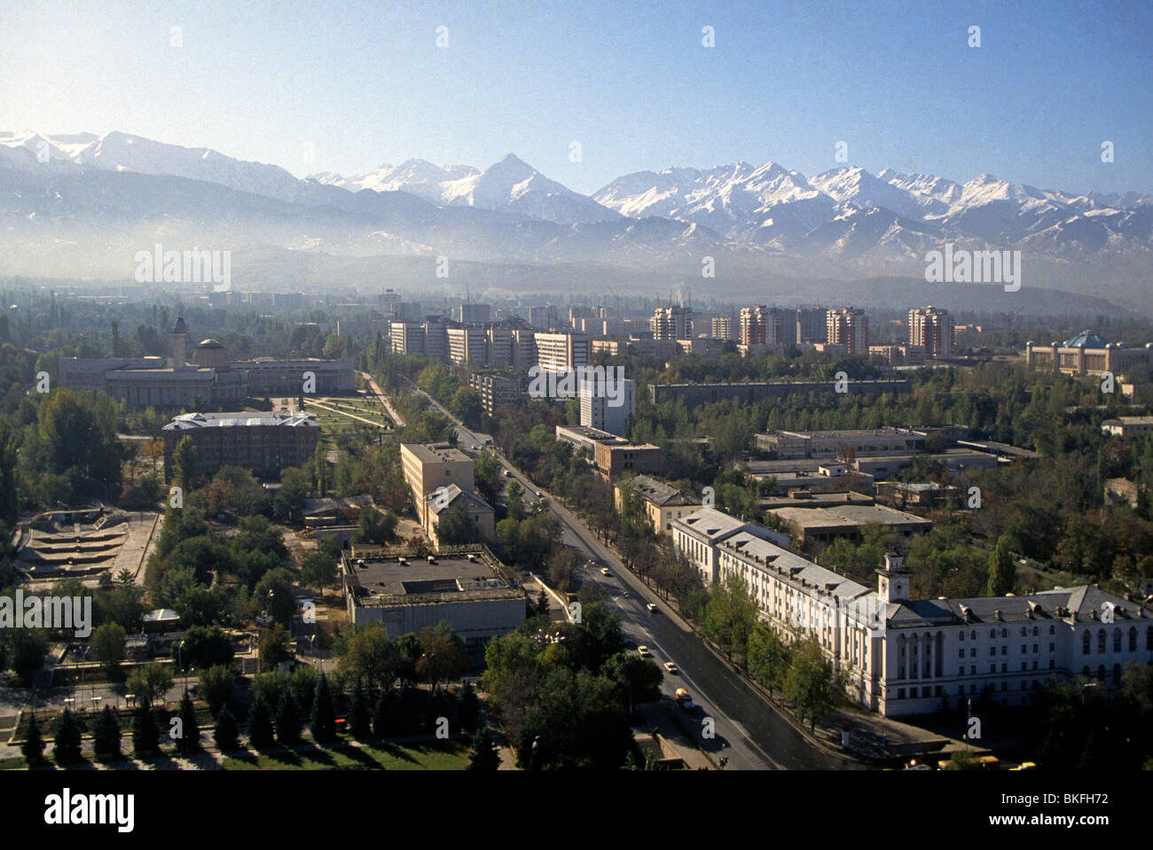 An aerial of Almaty, Kazakhstan, in the shadow of the Zailisky Alatau ...
