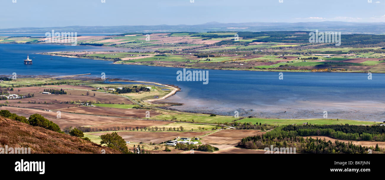 View from cnoc Fyrish off A836 near Alness overlooking Cromarty Firth & Nigg bay, Scotland with oil rigs in bay Stock Photo