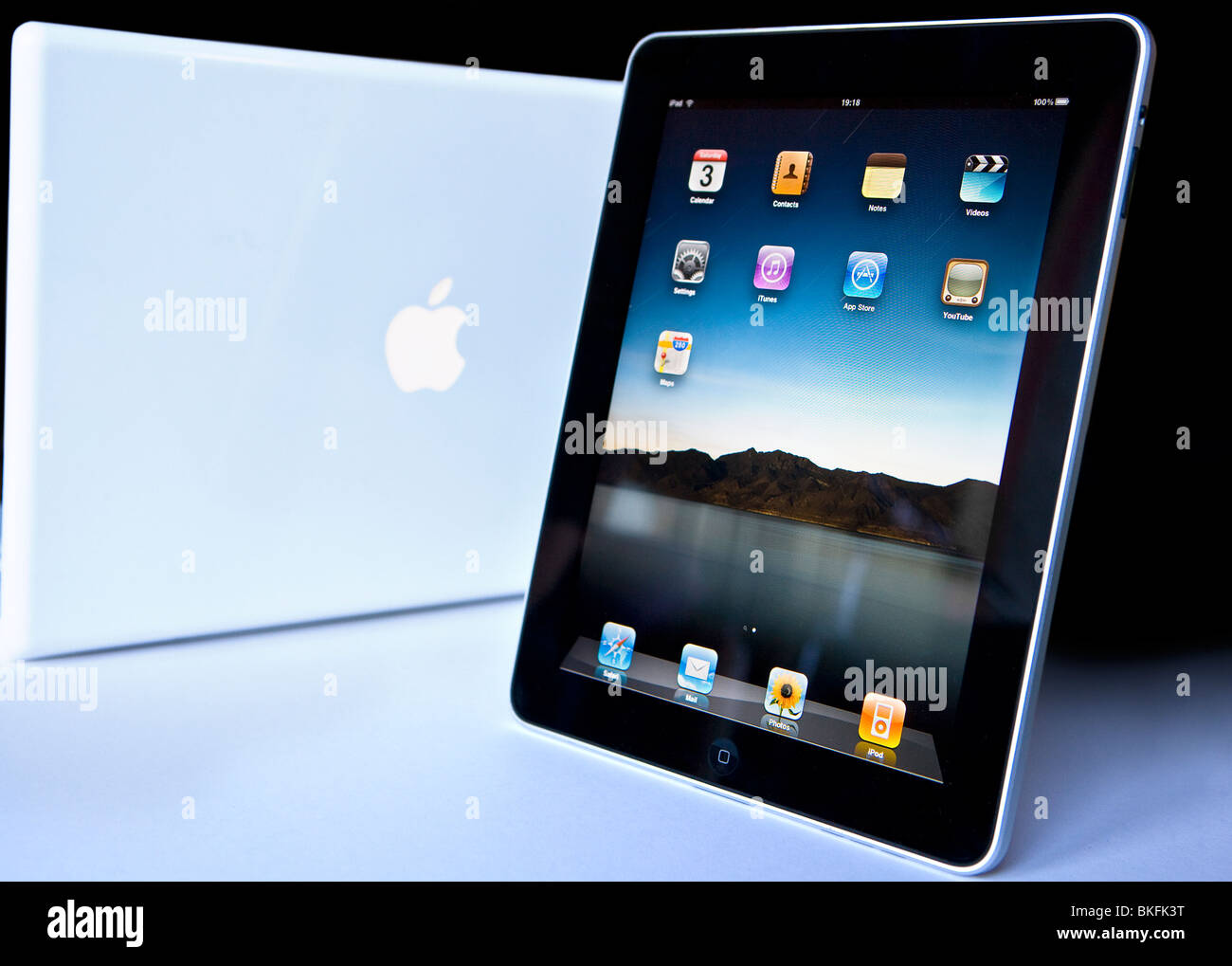 An Apple ipad and Mac Book Stock Photo